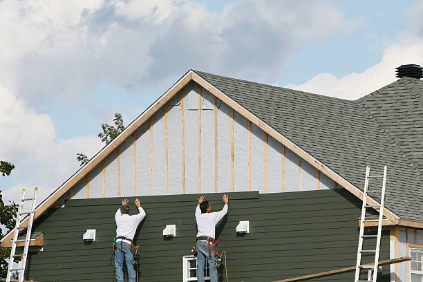 Professional Siding Contractor technician working in Amherst, TX